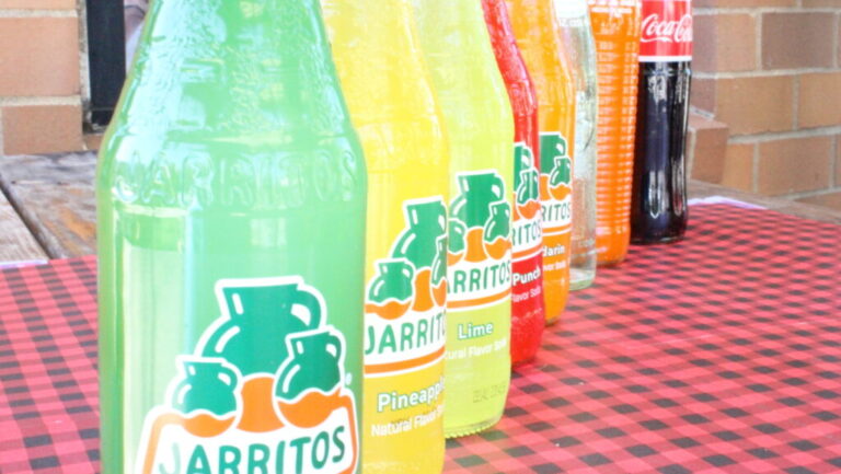 Colorful Jarritos Mexican fruit-flavored sodas displayed at Los Tacos Locos